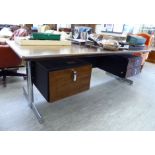 A modern rosewood desk, the top with rounded corners, over two twin drawer pedestals,