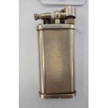 A 'vintage' Dunhill Unique silver coloured metal cased gas cigarette lighter 11