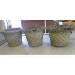 Three composition stone garden planters with basketweave decoration 18''h 24''dia SL
