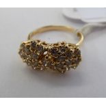 A 14ct gold claw set diamond cluster ring 11