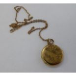 A 9ct gold disc pendant,