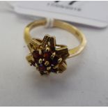 A 9ct gold garnet set cluster ring 11