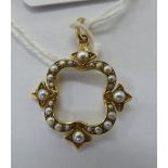 An 'antique' gold coloured metal pendant,