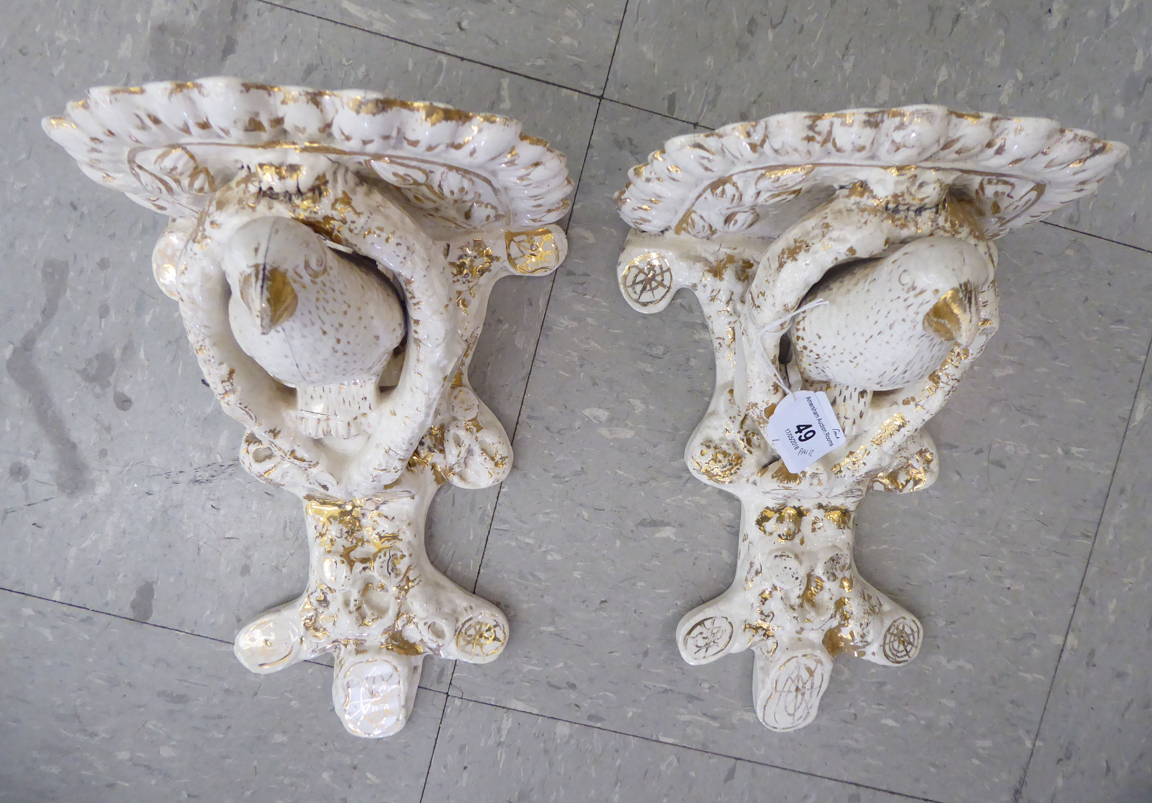 A pair of late 19thC Continental porcelain moulded, glazed and gilded Chinese wall brackets,