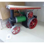 A Mamod live steam model traction engine, in green, red,