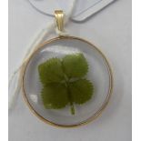 A 9ct gold and glazed pendant,