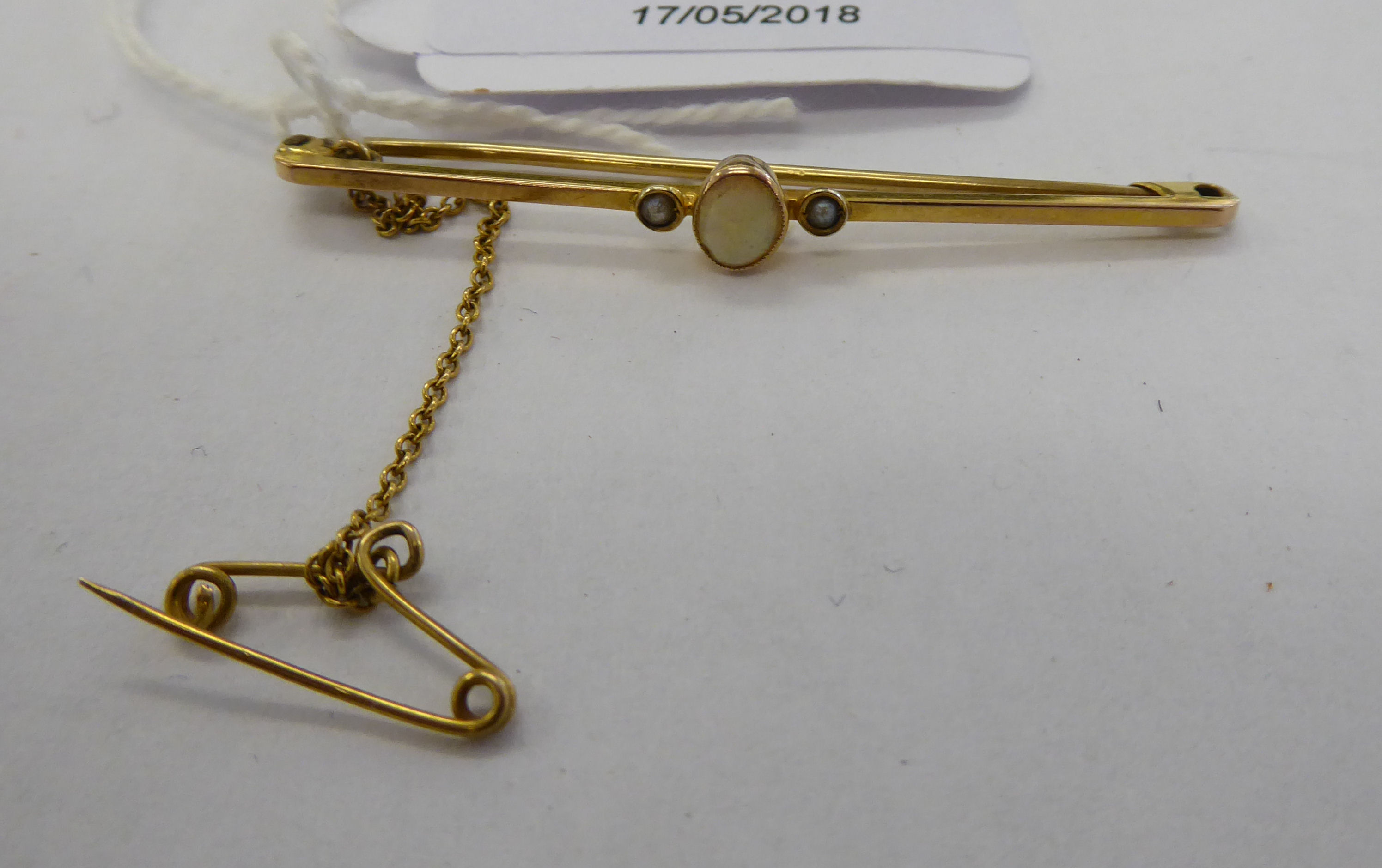 An 'antique' 9ct gold opal set bar brooch 11