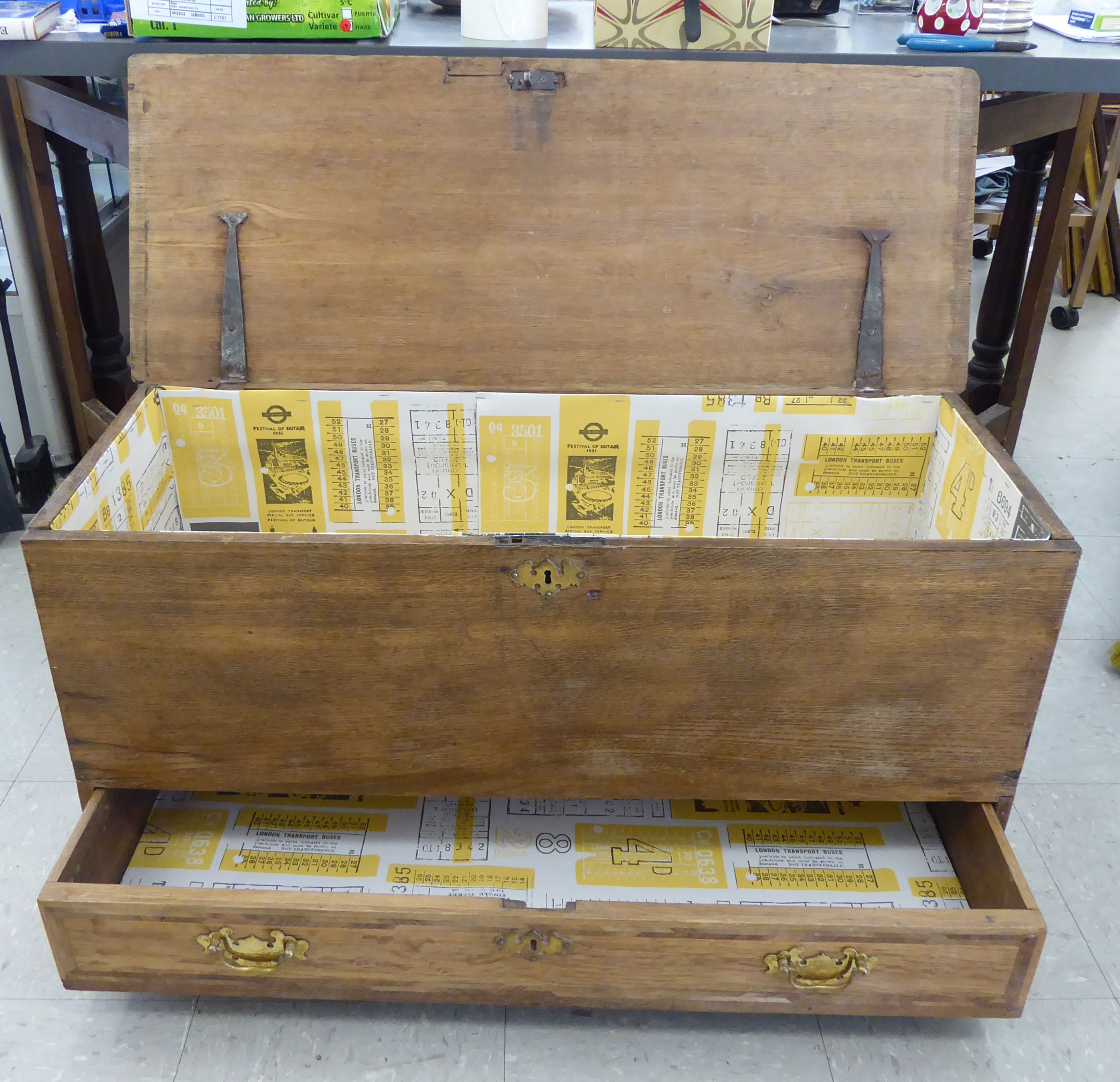 An early/mid 20thC pale oak chest with a hinged lid and straight sides, over a single long drawer, - Image 2 of 2