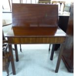 An early 19thC mahogany tea table with a foldover top, raised on square,