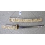 A late 19th/early 20thC Japanese short sword, the curved blade 11''L,