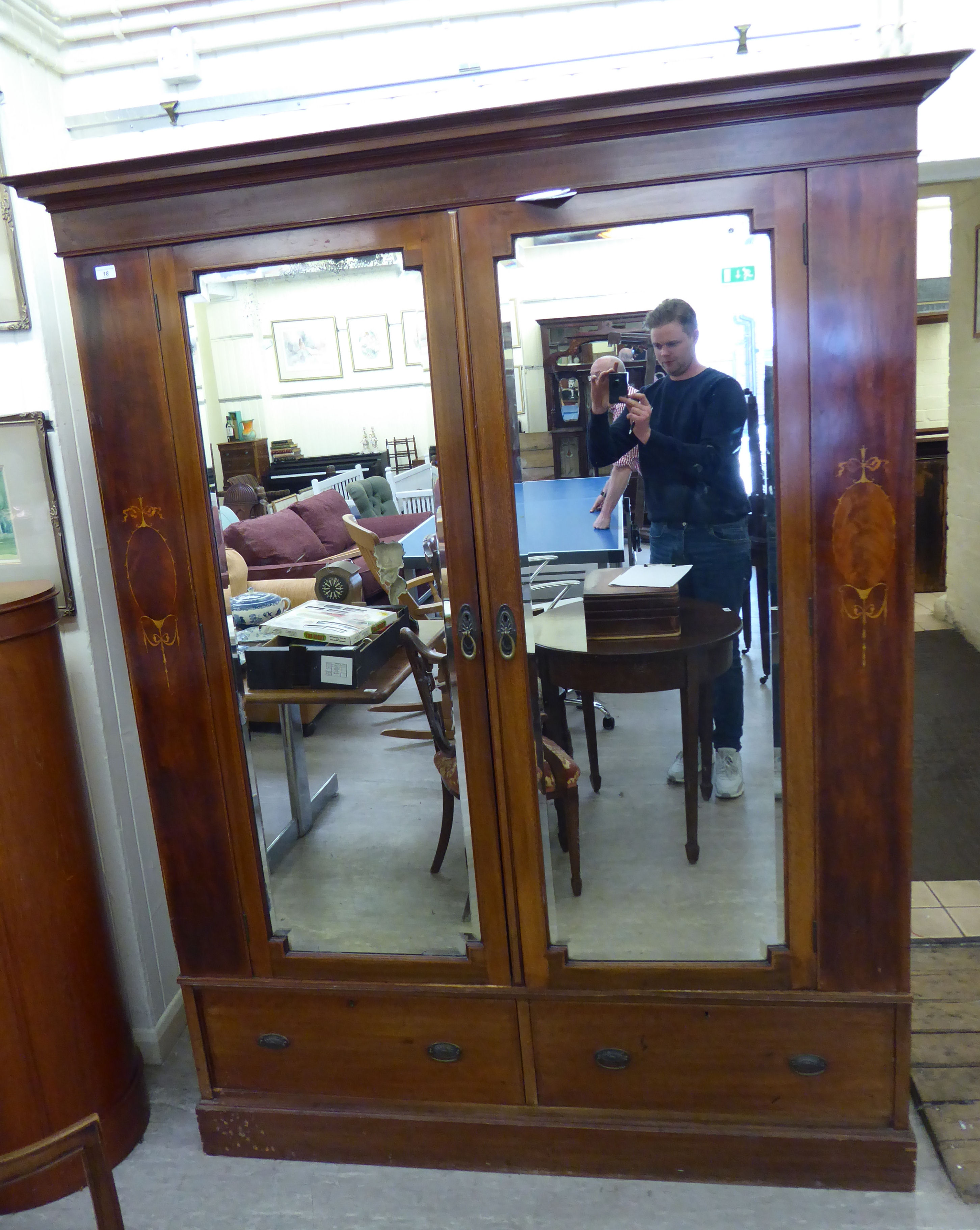 A late Victorian satinwood inlaid mahogany wardrobe with two mirrored doors and two drawers,