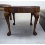 A 1930s walnut occasional table with a quarter veneered top,