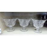 A set of seven Waterford crystal pedestal sundae dishes with floral line-cut ornament OS2