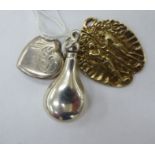 Pendants: to include a silver gilt Adam & Eve example; one, a silver heart shape; and another,