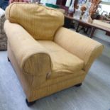 An early 20thC armchair, the low back and level,