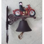 A cast iron door bell, fashioned as a man on a motorbike,
