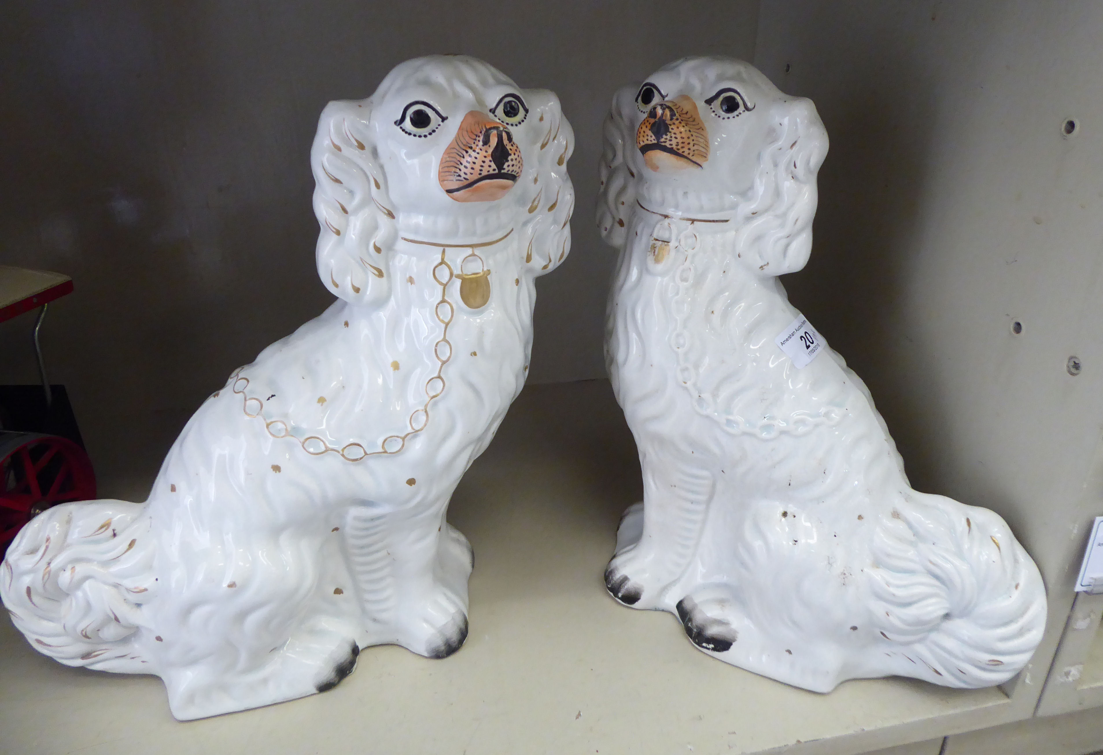 A pair of late Victorian Staffordshire pottery, ivory glazed models,