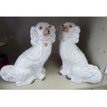 A pair of late Victorian Staffordshire pottery, ivory glazed models,