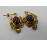 A pair of 9ct gold and garnet set pendant earrings 11