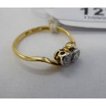 An 'antique' 18ct gold two stone diamond crossover ring 11