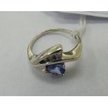 A white gold crossover ring,