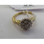 A 9ct gold claw set diamond cluster ring 11