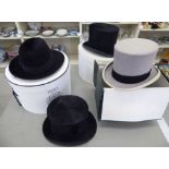 Four gentleman's hats: to include a Henry Heath Ltd black silk top hat 22'' circumference