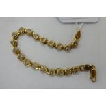 A 9ct gold cubic zirconia set bracelet 11