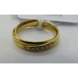 An 18ct gold crossover ring,