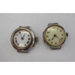 Two similar 'antique' round silver coloured metal cased ladies wristwatches,