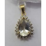 A 9ct gold pear shaped citrine and diamond set pendant 11