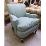 A late Victorian salon chair, upholstered in pale green fabric, raised on mahogany, square,