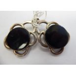 A pair of silver coloured metal and onyx,