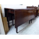 A George III mahogany drop leaf dining table,