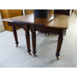 An early/mid 19thC mahogany dining table, the top with a thumb moulded edge and round corners,