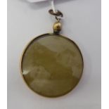 An 'antique' 9ct gold and glazed pendant 11