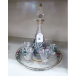 A mid 20thC glass liqueur decanter, six pedestal glasses and a serving tray,