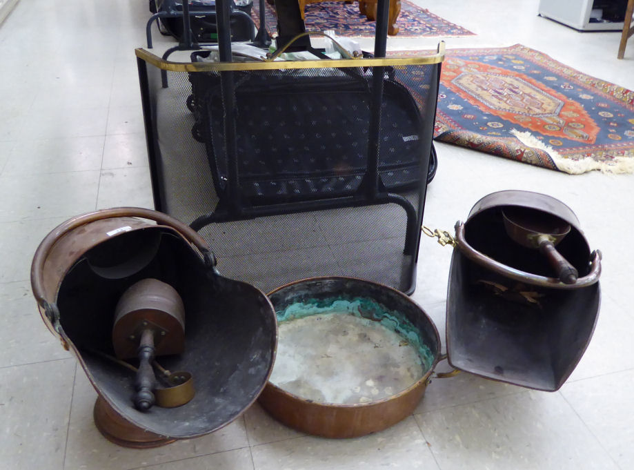 Hearth related items: to include an early 20thC copper coal scuttle with a swing handle SR