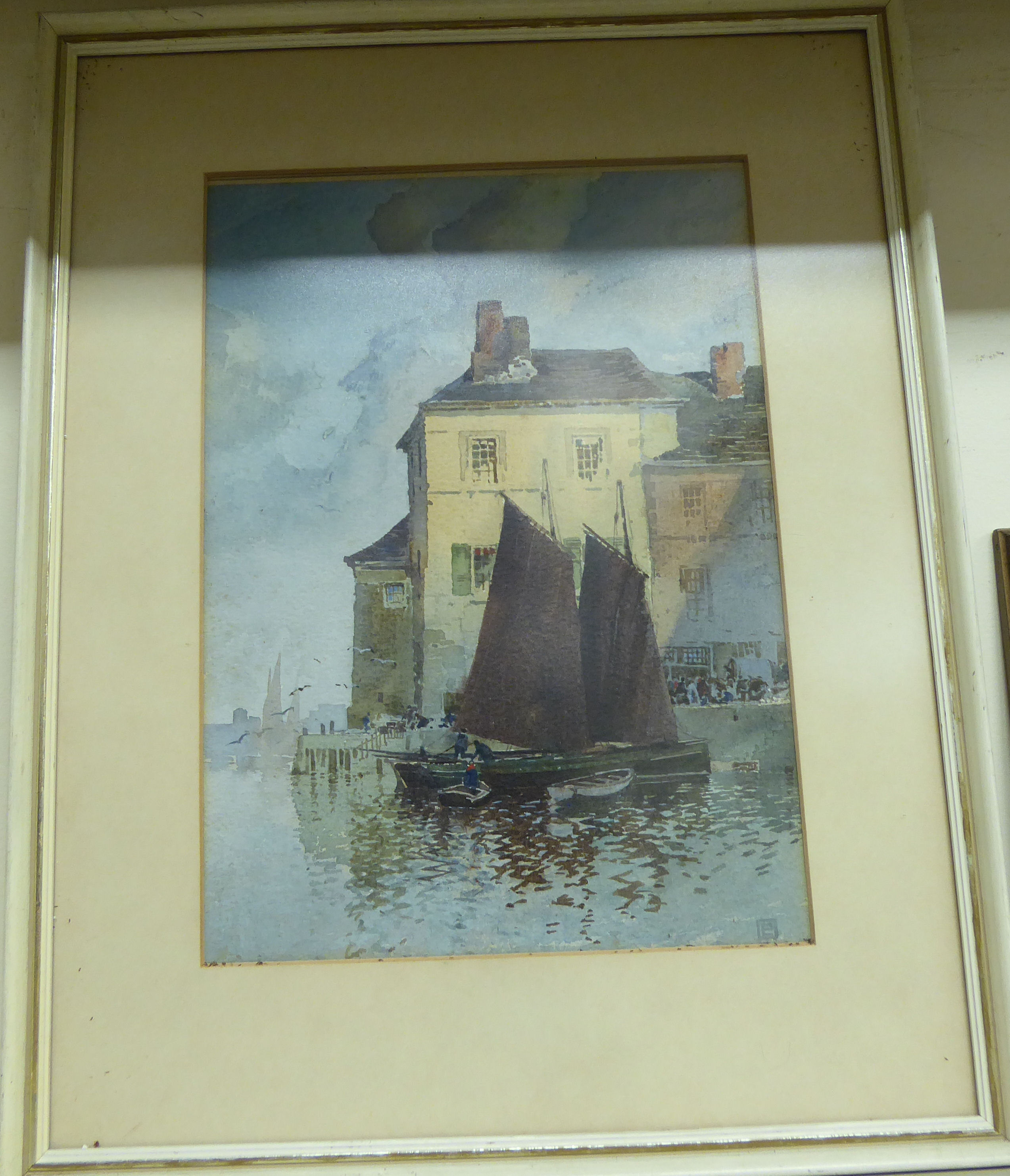 Attributed to Percy Lancaster - a quayside scene with figures unloading a sailing barge