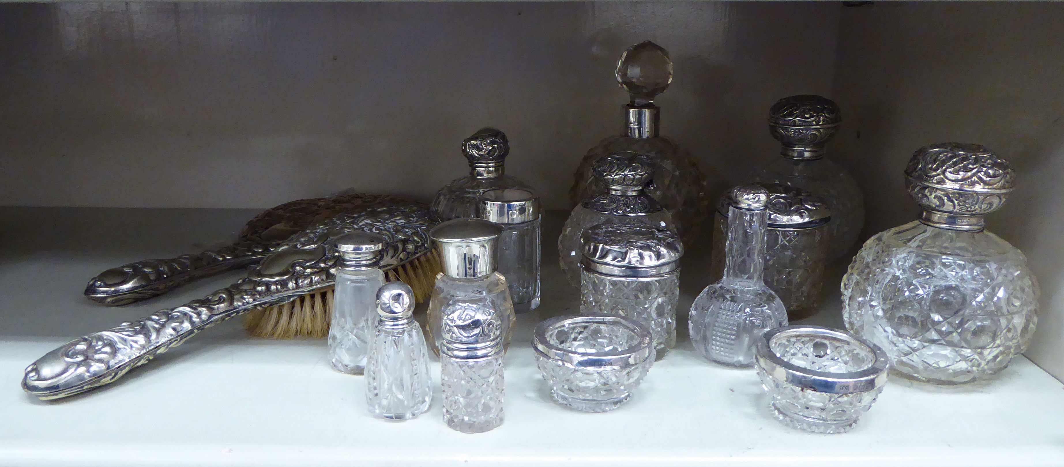 Silver capped dressing table items: to include scent bottles various forms & mixed marks OS3