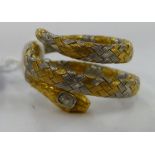 A late Victorian yellow and white metal serpent design scarf gatherer,