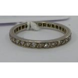 A white metal (possibly platinum) diamond set eternity ring 11