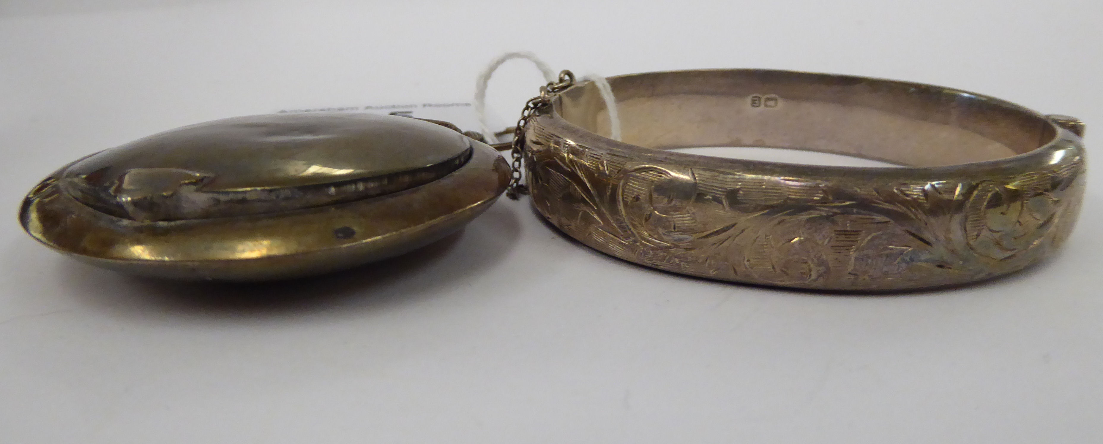 A silver pendant compact,