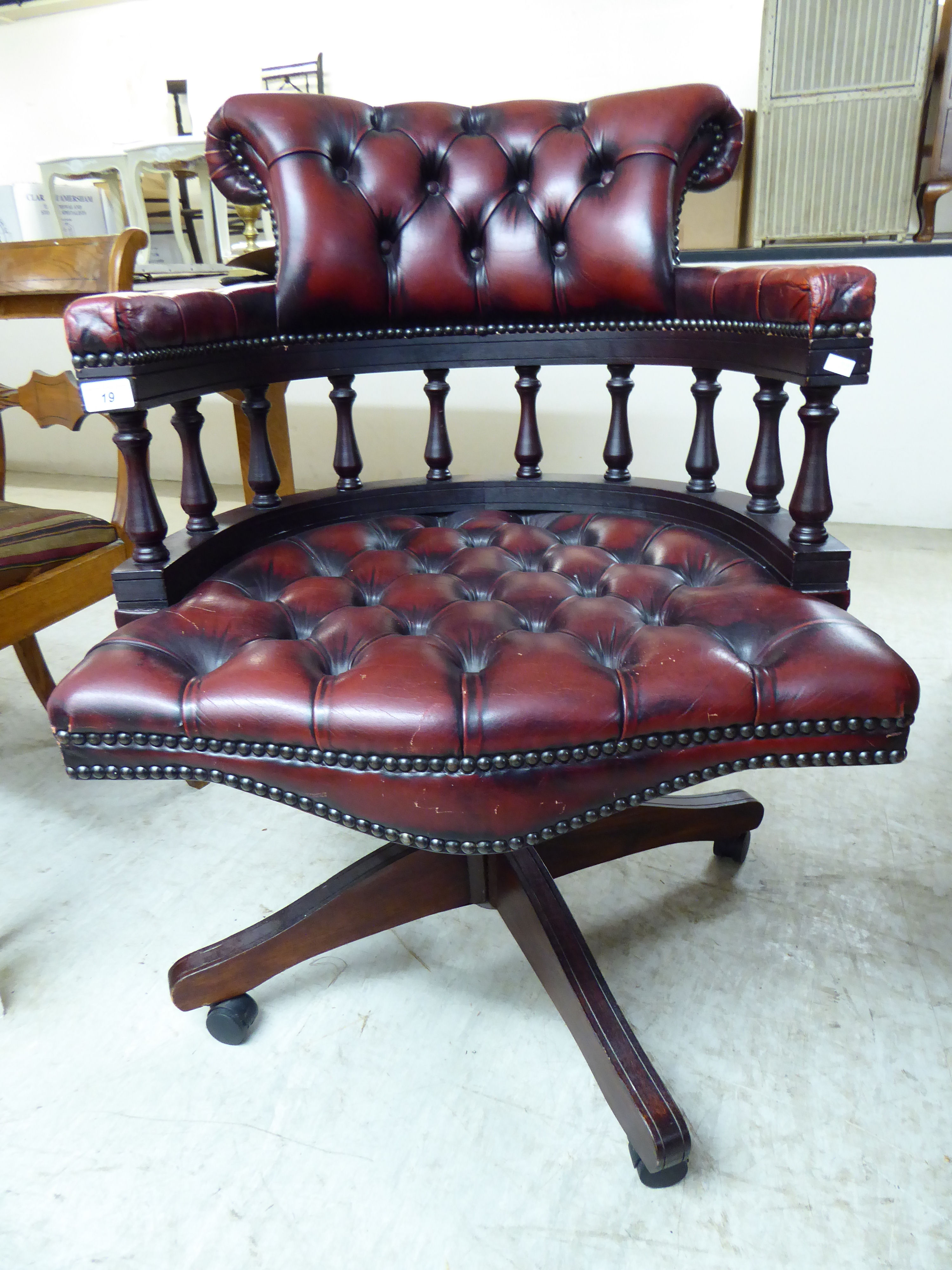 A mid 20thC mahogany framed desk chair,