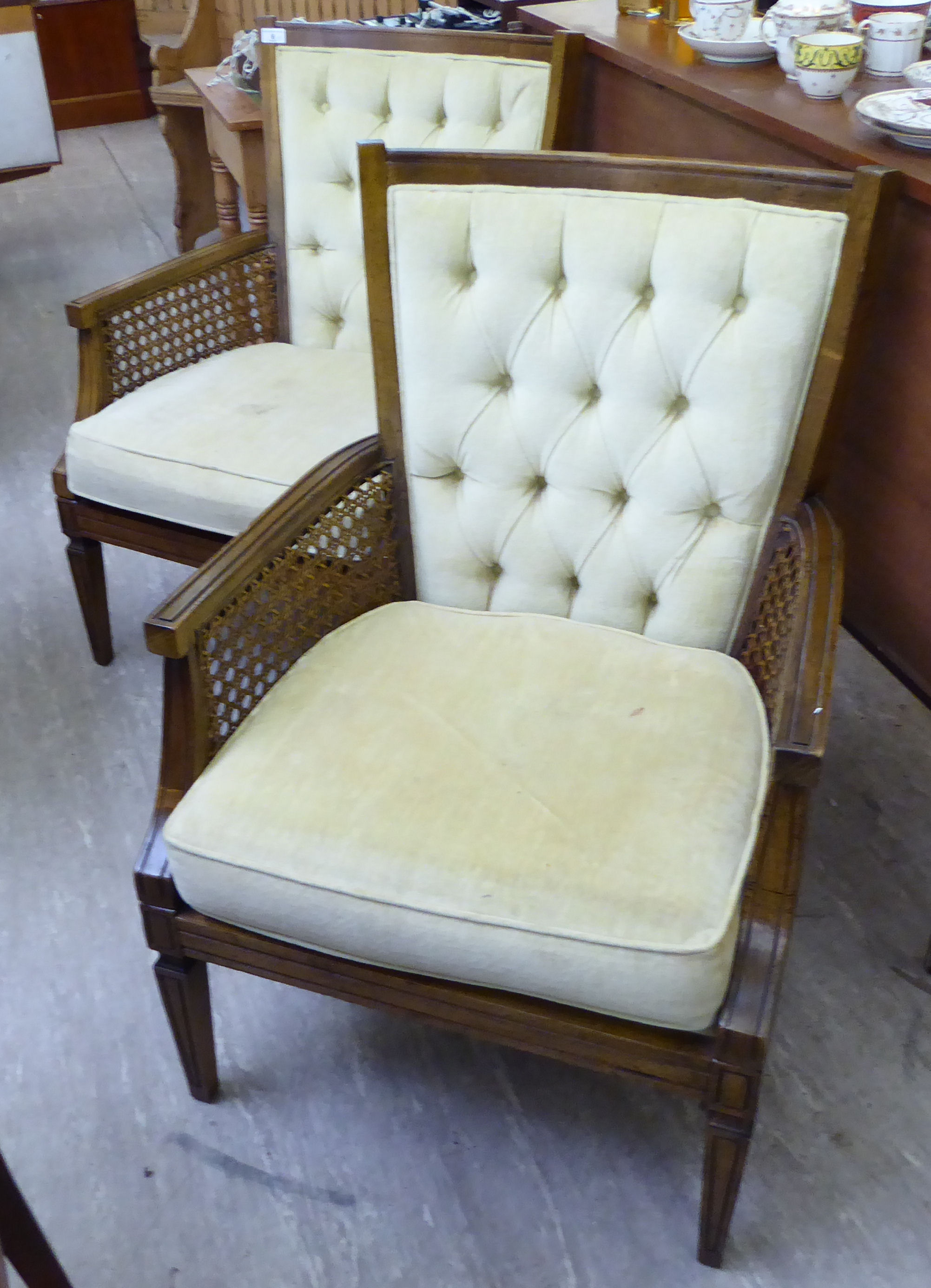 A pair of modern antique effect walnut framed salon chairs,