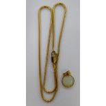 A 9ct gold pendant necklace, set with a circular cut opal,