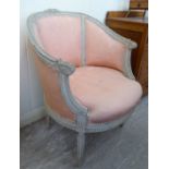 A 1920s/30s Louis XVI design cream painted tub design salon chair,