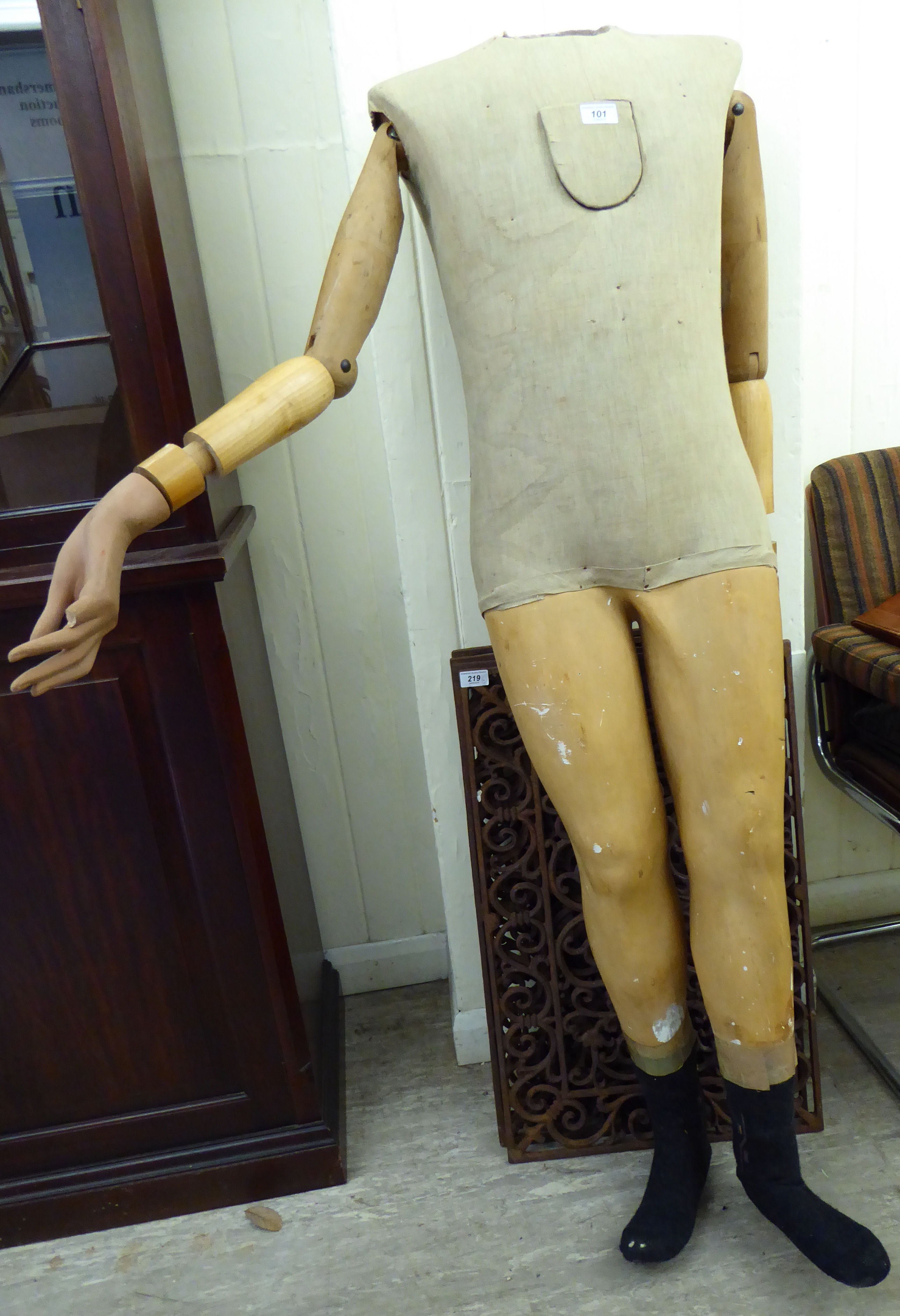 An early 20thC part painted moulded plaster and carved wooden mannequin (no head) the torso