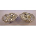 A pair of late Victorian silver heart shaped sweet dishes, on ball feet with embossed,