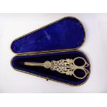 A pair of late Victorian silver grape scissors, the ring handles cast and pierced,